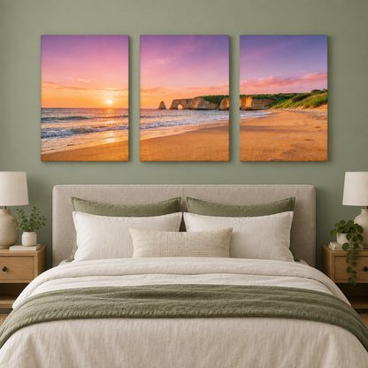 Three-panel Algarve cliff arch and beach sunset canvas set above a sage green bedroom bed - Portugal Canvas Co
