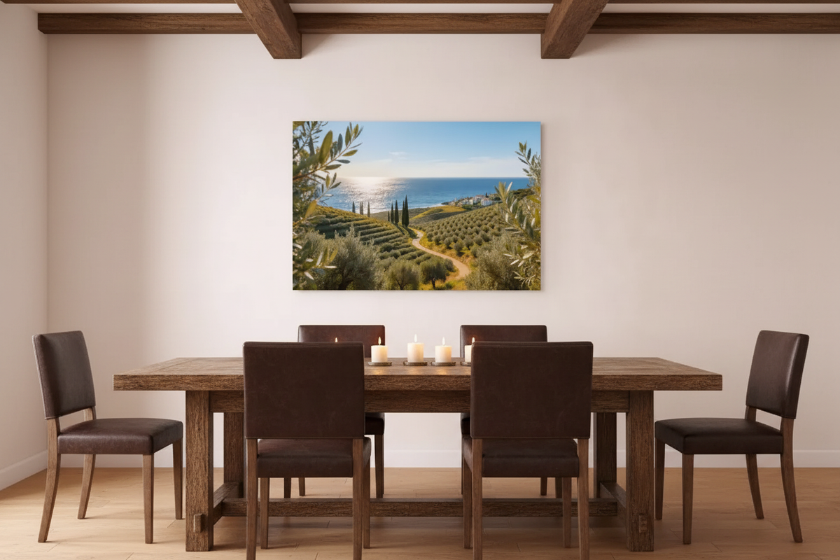 Mediterranean olive grove coastal landscape canvas wall art displayed above a rustic wooden dining table with leather chairs in a warm farmhouse dining room - Portugal Canvas Co