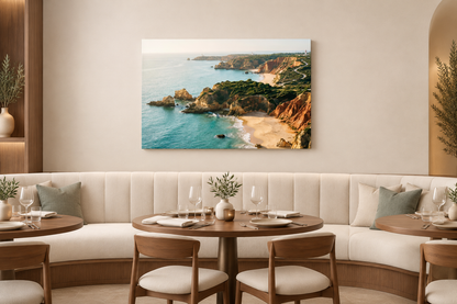 Algarve sandy cove and turquoise sea canvas above curved banquette in coastal restaurant - Portugal Canvas Co