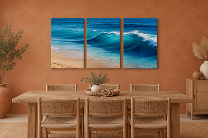 Ocean Wave triptych above a timber table in a terracotta coastal dining room with even lighting - Portugal Canvas Co