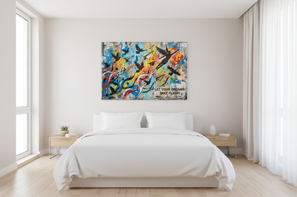 Let Your Dreams Take Flight inspirational graffiti canvas wall art with bird silhouettes, paper planes and winged figure displayed above a bed in a bright modern bedroom - Portugal Canvas Co

